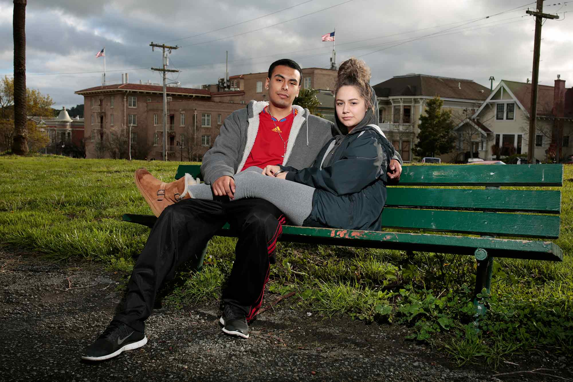 photo of a young couple on a park bench by 
Ramin Rahimian